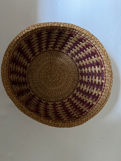 Vintage Hand-Woven Round Basket with Brownish Red Design